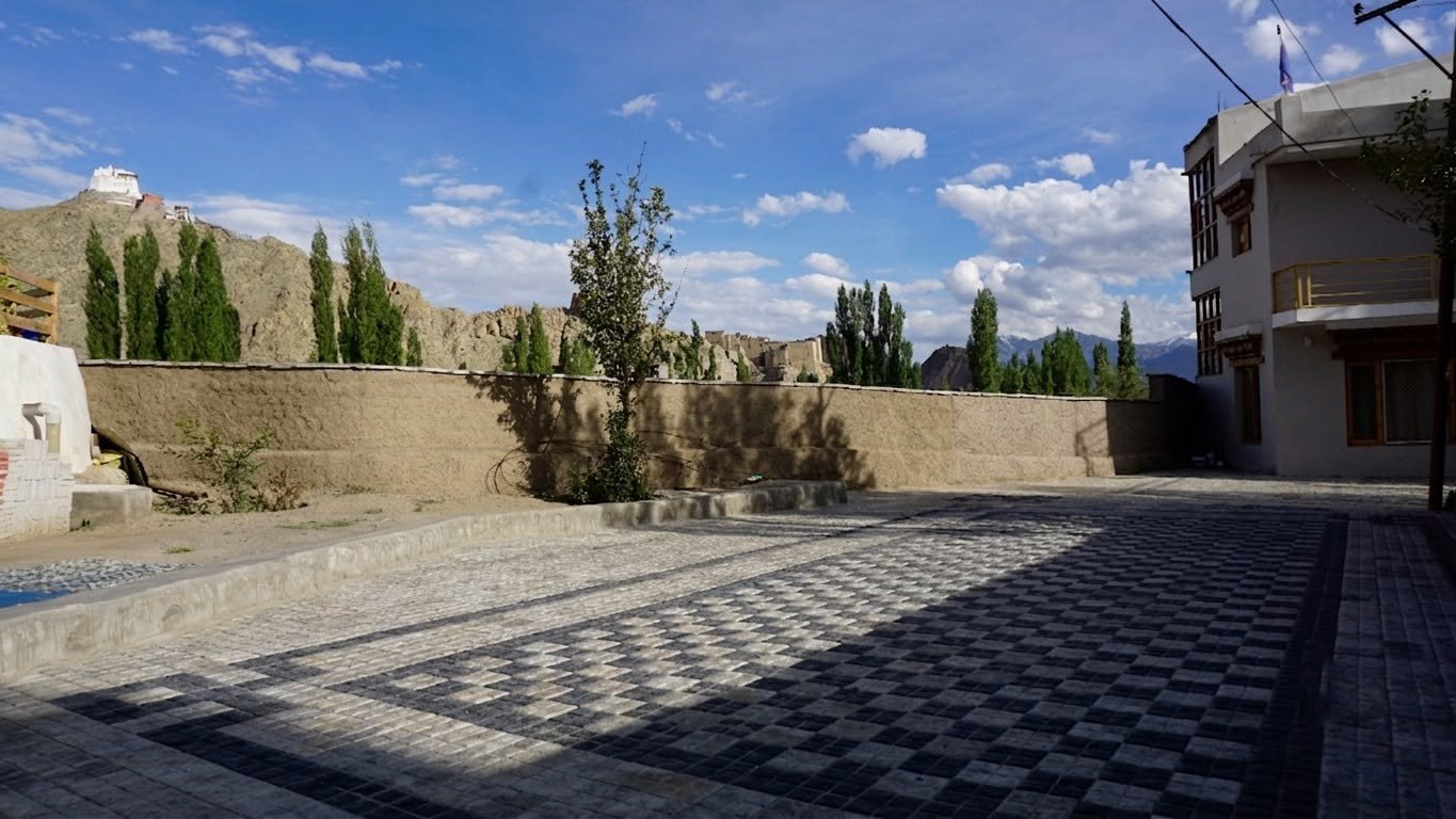 Courtyard and parking with a view of the hills